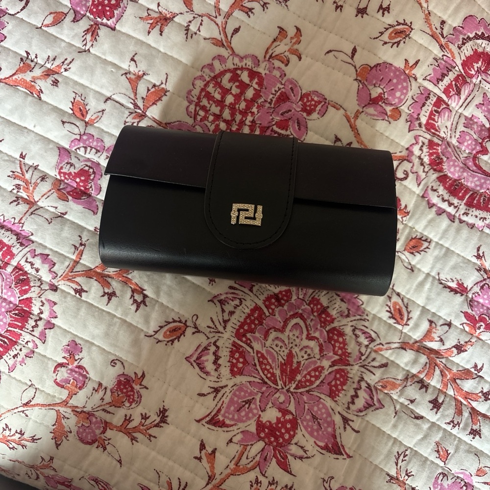 Sleek Black Leather eyeglass case with Gold-Toned Geometric Detail